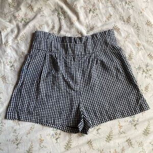 black and white plaid shorts size small with side pockets in good condition